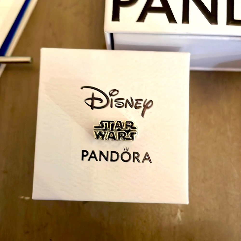 New Authentic Pandora Star Wars x Disney Logo Charm never worn on a bracelet.